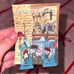 The Olive Universe Blue Guillotine Earrings with Birthday Cake Accent